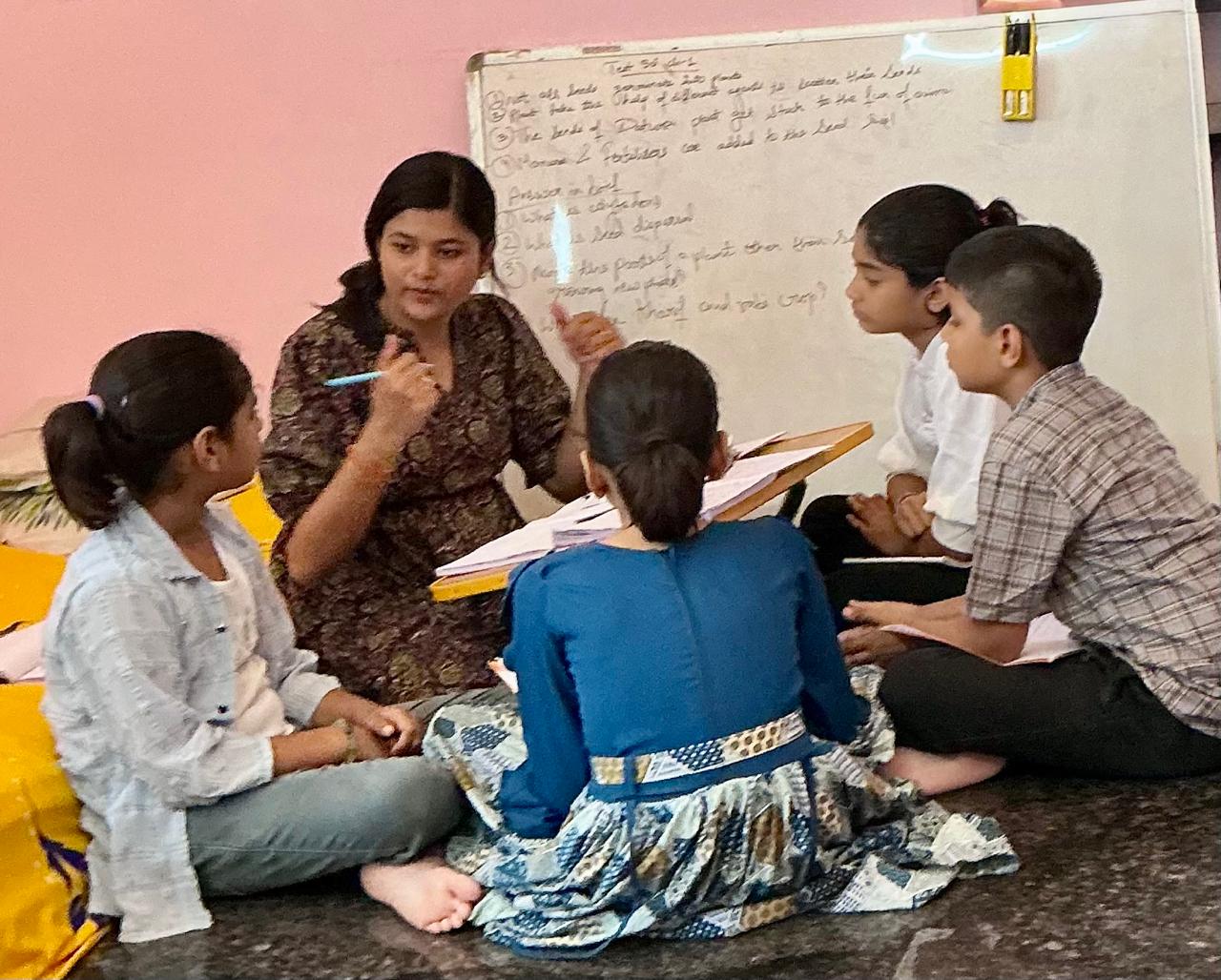 Digital classroom at Divya Classes with students using tablets for interactive learning